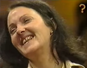 Female contestant looking away from the camera and laughing
