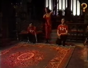 Contestants wearing red shirts saying 321 stood next to a carpet