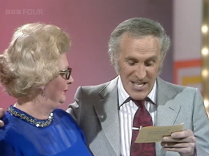 Host reading card to contestant