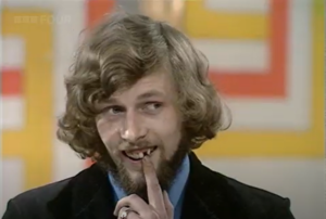 Contestant pointing at his missing tooth