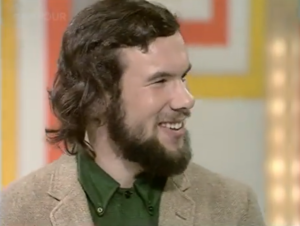 Male contestant looking to the side