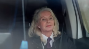 Character sat in the car