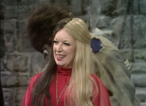 Contestant smiling looking away from the camera