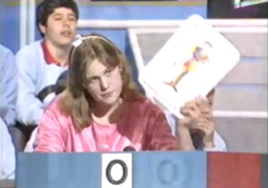 Contestant Holding up a photo