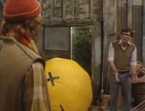 Screenshot from episode 5 of two characters talking